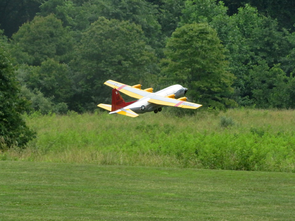 Club members work on a plane